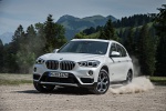 2019 BMW X1 xDrive28i in Alpine White - Driving Front Left Three-quarter View